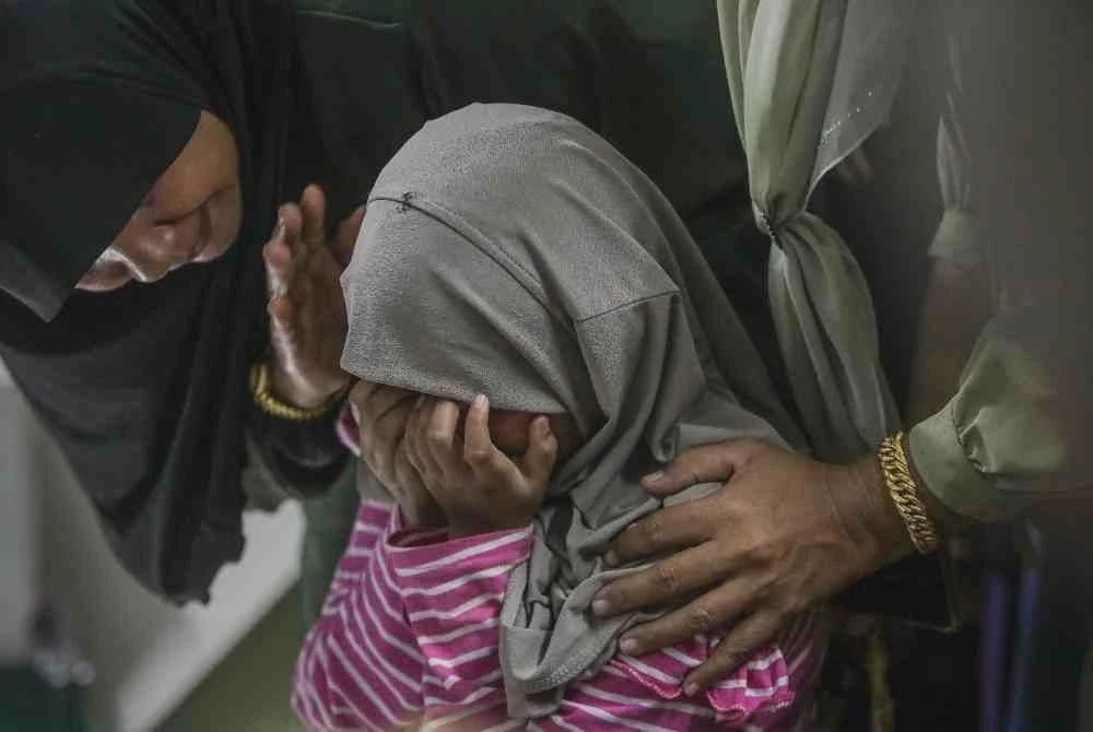 Image from: Dua mangsa kepala air disemadikan dalam satu liang lahad