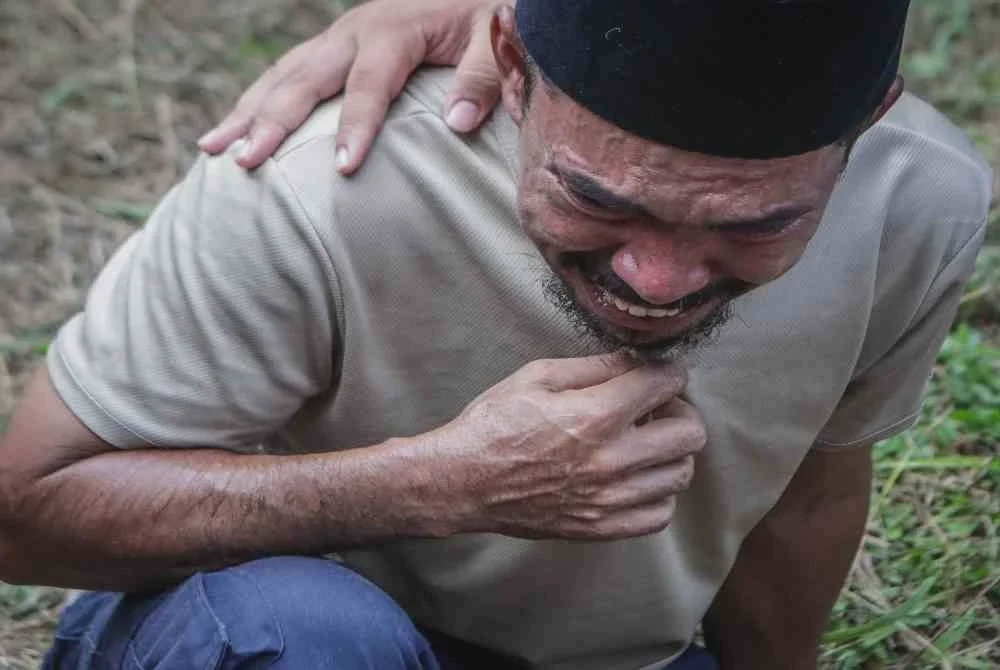 Image from: Dua mangsa kepala air disemadikan dalam satu liang lahad
