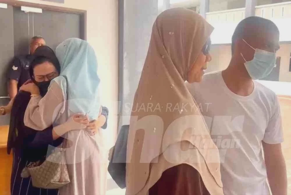Image from: Suami isteri terlepas hukuman mati, menangis peluk ahli keluarga