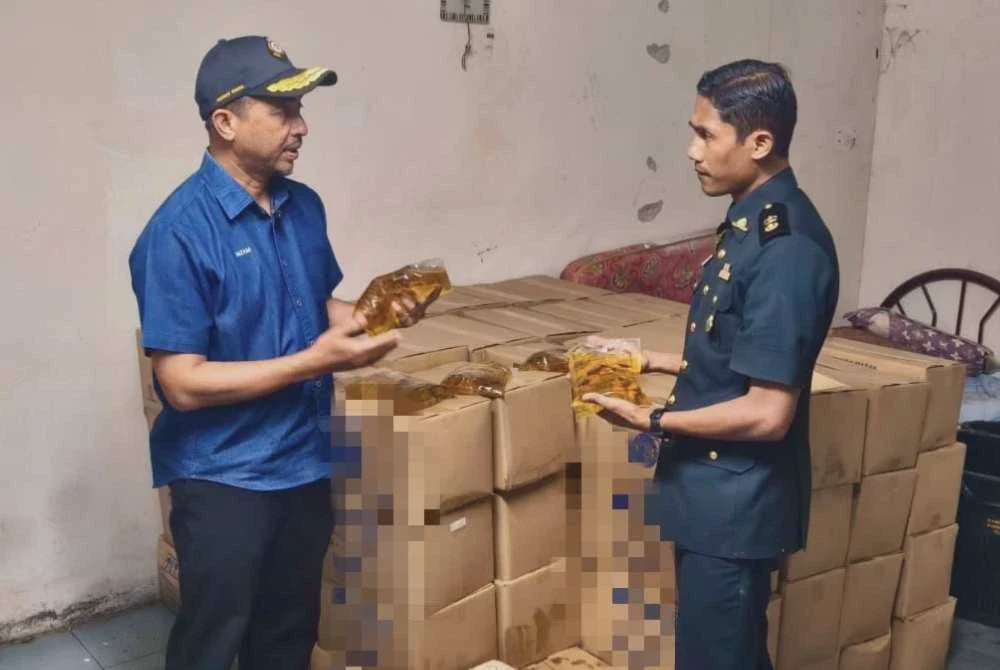 Image from: [VIDEO] Gudang pakaian terpakai diserbu, simpan minyak masak bersubsidi