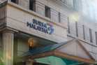 Bursa Malaysia claws back losses but remains stuck below 1,600
