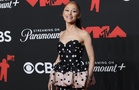 Ariana Grande ditches high heels after suffering 'deep cut'