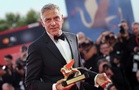 George Clooney blasts those who 'peddle in fear' in defiant Venice speech