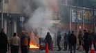 Cars and homes burn as unrest erupts in Belfast after knife attack