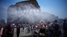 Water cannons cool tourists at Rome's Colosseum amid heatwave