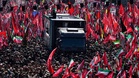 Ali Khamenei's coffin carried through the streets of Tehran