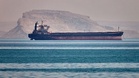 Ship hit in Hormuz as Iran's top negotiator says strait to stay shut