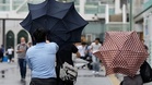 Flooded streets and rescues as Typhoon Dujuan hits Japan