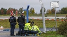 German police say two men turned themselves in after smashing car into airport fence