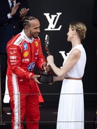 Charlene hands trophy to Lewis Hamilton after losing to Kimi Antonelli