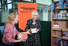 Queen Camilla unveils bookshelves containing her favourite titles