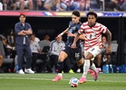 Why are so many players wearing pink boots at the World Cup?