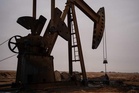Oil stays at lower level after price drop due to Iran deal