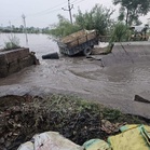 Breach in canal tributary floods fields
