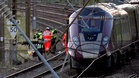 One dead and dozens injured in train collision north of London