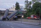 One killed as freight train plunges from bridge in Germany after crash