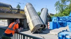 One killed as freight train plunges from bridge in Germany after crash