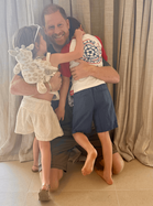 Meghan shares new photo of her children in tribute to Harry as Archie pictured wearing England top