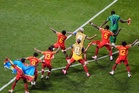 Congo rallies to a 3-1 win against Uzbekistan to seal place in World Cup knockouts