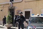 Italian police make arrests after investigative reporter's car bombed