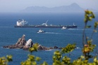 Oil tanker catches fire after projectile strike in Strait of Hormuz as Iran mourns Khamenei