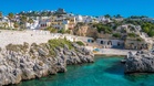 In Italy, this overlooked clifftop village in Puglia hides turquoise caves and serves fried fish overlooking the Adriatic