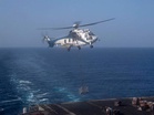 USS Abraham Lincoln enforcing naval blockade near Iranian ports; Receives supplies during vertical replenishment: CENTCOM