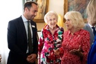 Queen Camilla chats with the Princess of Wales's brother during reception at royal residence
