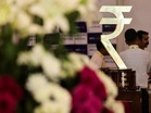Rupee under pressure as oil surge, FII outflows: Analysts