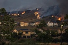 Thousands evacuated as wildfires spread across southern California