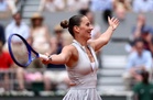 Marta Kostyuk stuns Iga Swiatek on her birthday to reach a first French Open quarterfinal