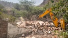Gurugram police demolish illegal structures built by criminals at Peer Colony