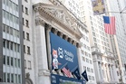 The Dow hits a record as most of Wall Street rises, but slumping AI stocks keep indexes mixed