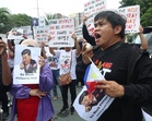 Protesters tell China's foreign minister: Apologize over racist AI video, stop WPS aggression