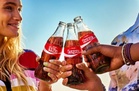 Coca-Cola lifts annual forecasts