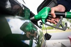 Oil firms lower pump prices