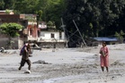 New flood risks slow Nepal, Tibet rescue