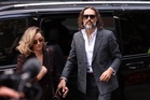 Comedian Russell Brand appears in UK court for start of rape trial