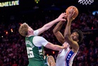 Embiid posts triple-double to keep 76ers perfect