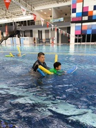 Ex-pupil takes time off for free swimming lessons at former school