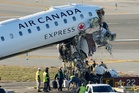 Runway safety failures and overwhelmed controllers cited in deadly LaGuardia plane collision