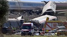 Spain train collision kills 68 as minister cites rail safety system failure