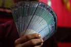 Ringgit ends higher v US dollar, other notes amid rising oil prices