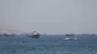 US says sunk Iranian small boats, shot down missiles, drones as it opens Hormuz