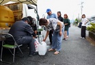 Japan's earthquake leaves communities thirsting for water and relief from heat