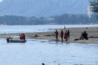Firemen rescue woman stranded on sand bar at Balok Beach