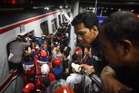 Taxi firm faces probe after Indonesia train crash kills 15
