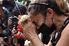Families claim bodies as Bangkok fire toll rises to 30