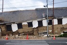 Rescuers search for survivors after powerful Japan quake kills 13
