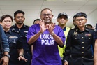 Abdul Azeez chose to remain in lock-up attire, handcuffs at court